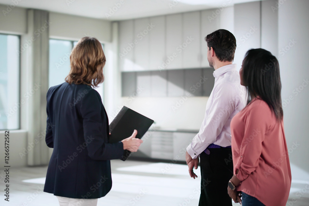 Real Estate Agent Shows New Property to Diverse Couple Real Estate Agent Shows New Property to Diverse Couple