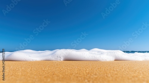 World Water Day Concept, Golden Sandy Beach with Waves Crashing Under a Bright Blue Sky Capturing Nature's Serene Beauty photo