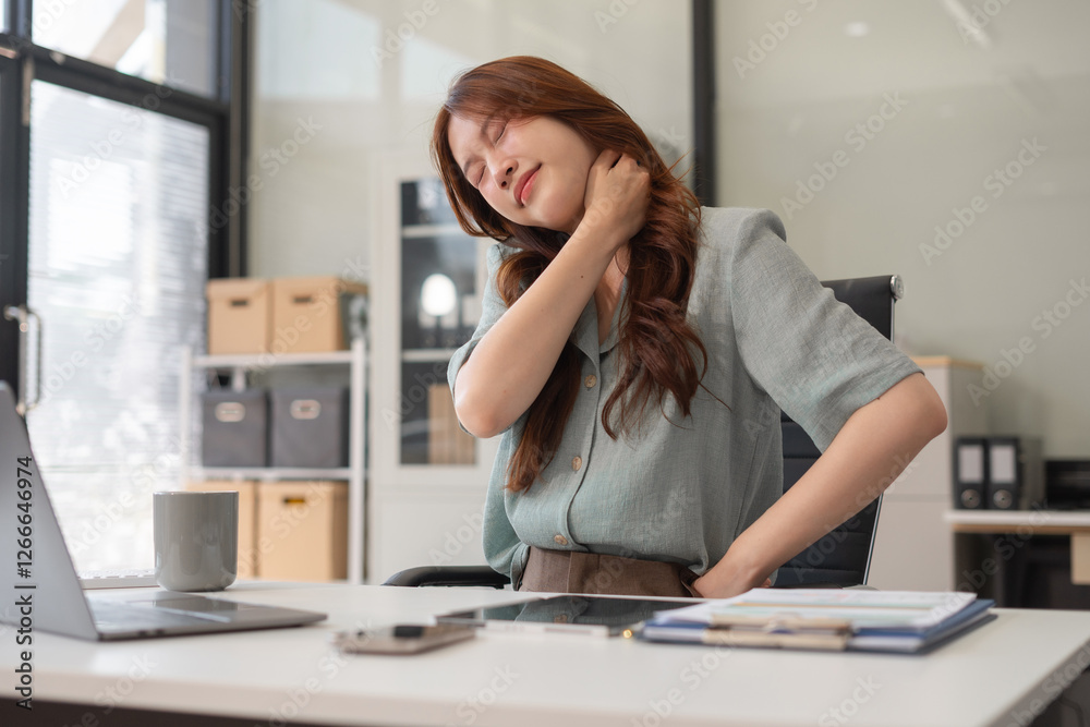Businesswoman is doing a stretchy posture due to sitting in the office.