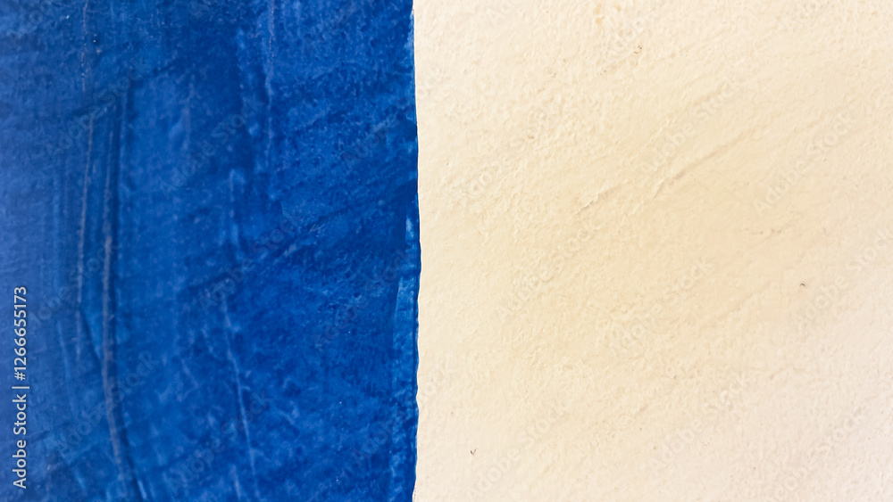 Fototapeta premium Blue and light yellow background. Uneven grain, smooth texture. Light blue and yellow background. Abstract background..