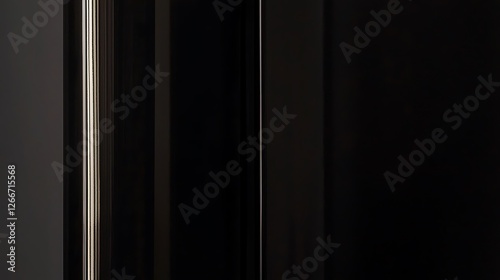 A black and white photo of a door with a light shining on it