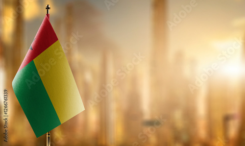 Schilderij op canvas Small flags of the Guinea Bissau on an abstract blurry background