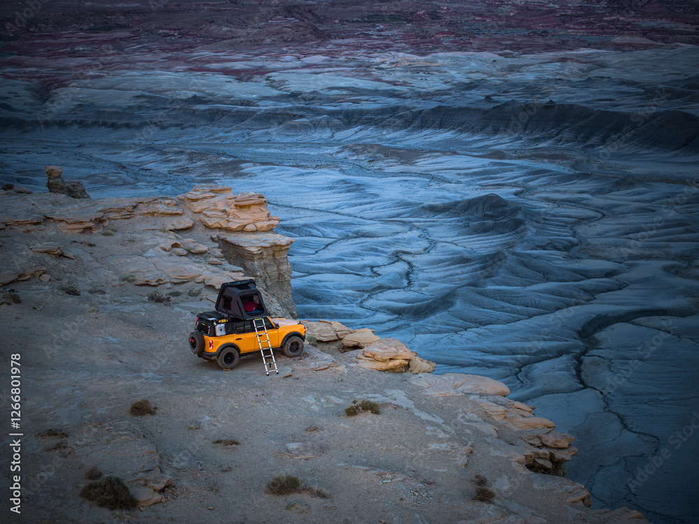 Yellow Truck Rooftop Tent Camping on a Cliff at Twilight Yellow Truck Rooftop Tent Camping on a Cliff at Twilight