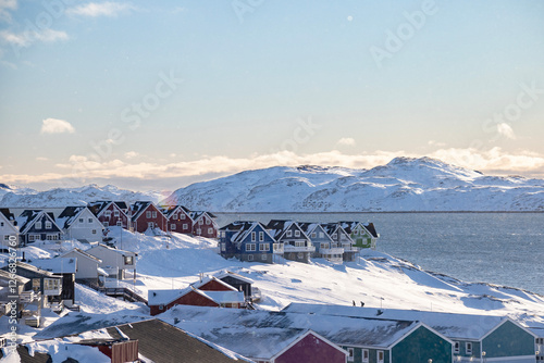 Nuuk the capital of Greenland.  Beautiful colored houses in a sunny winter landscape by the sea