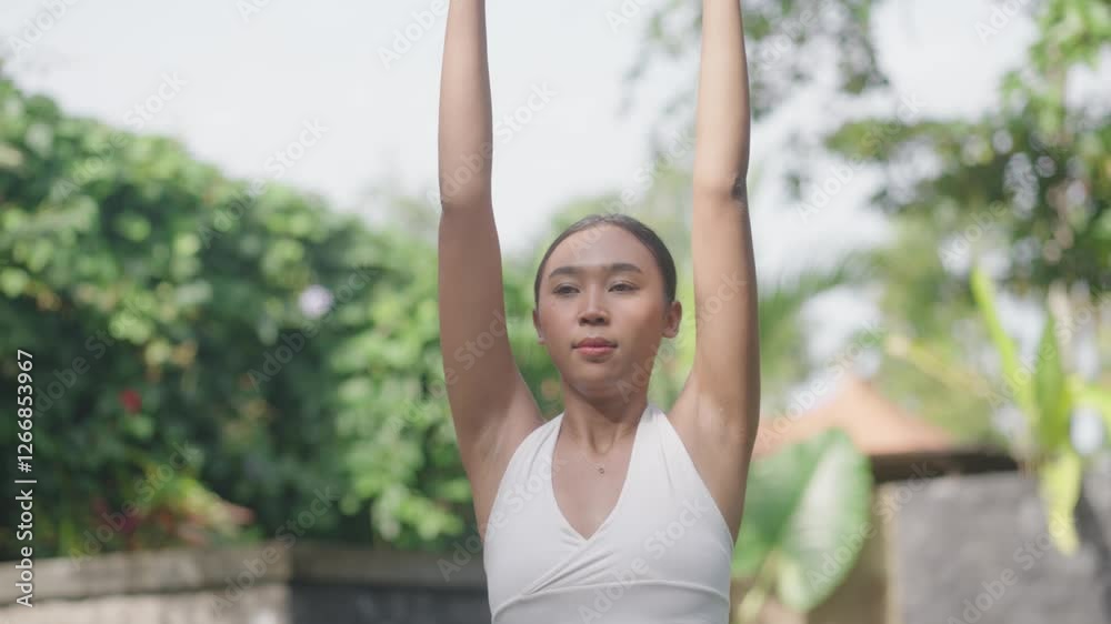 Three Person Yoga Pose Movement On Beautiful Lush Garden Green Grass in Ubud Bali Indonesia Three Person Yoga Pose Movement On Beautiful Lush Garden Green Grass in Ubud Bali Indonesia