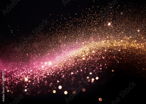 黒い背景にゴールドとピンクの光