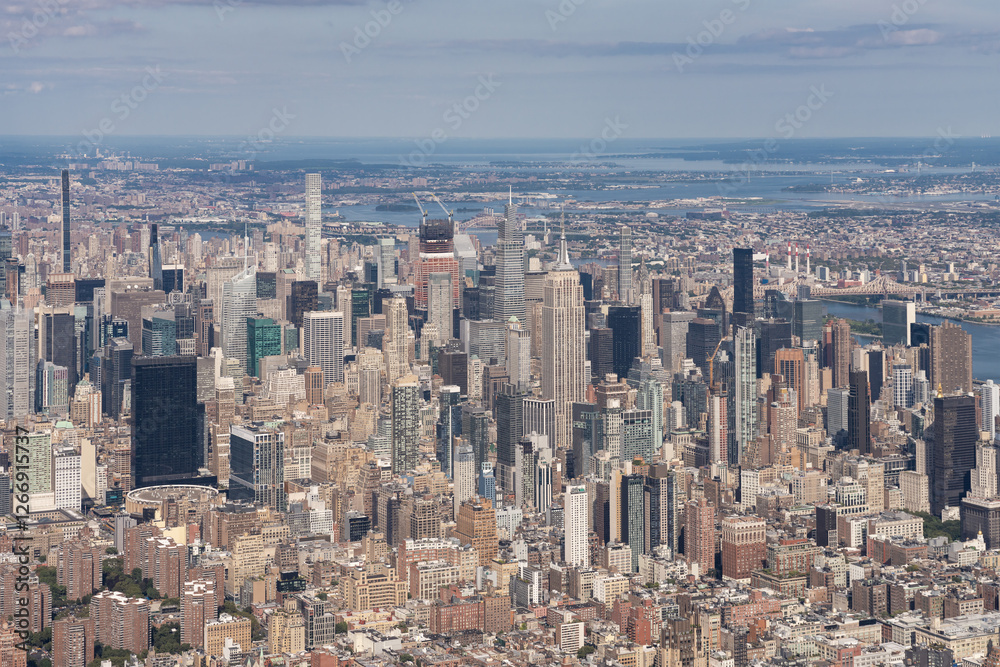 Manhattan skyline aerial view with iconic skyscrapers, New York City, USA, daytime. Manhattan skyline aerial view with iconic skyscrapers, New York City, USA, daytime.