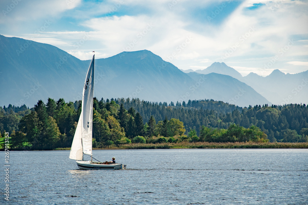 Naklejka premium Sailing on Ammersee with a Stunning Mountain Backdrop