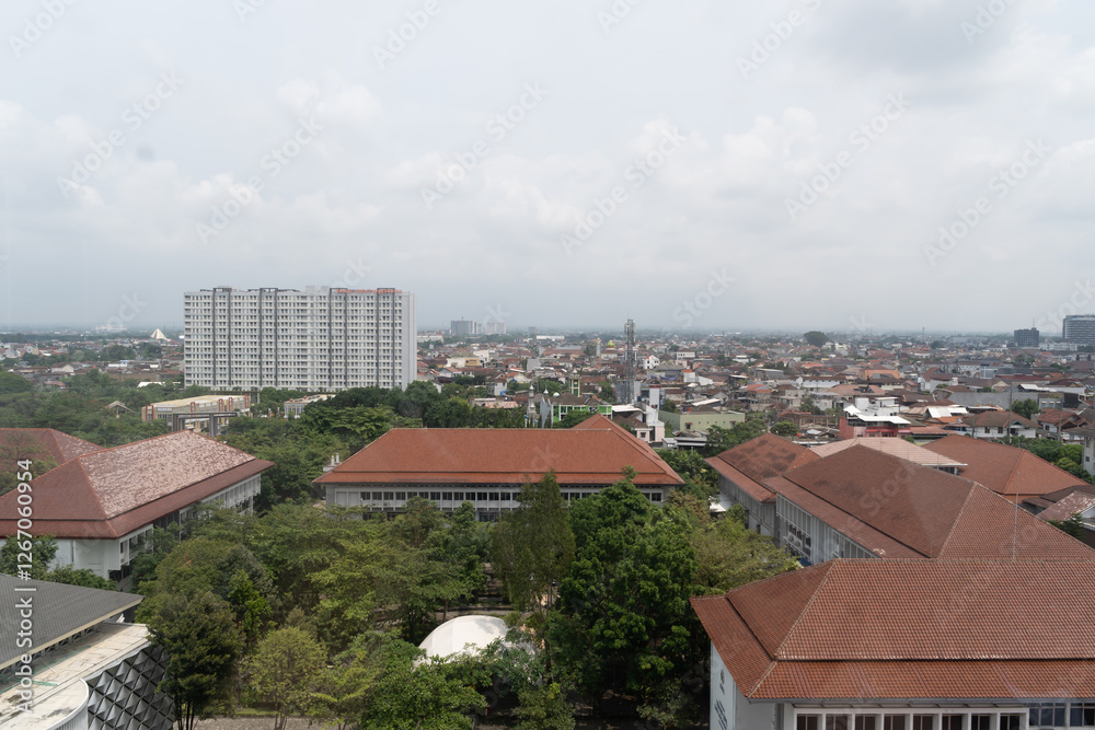 View of trees with buildings and housing from the rooftop in Indonesia, dense cities, green cities, roofs of buildings and housing View of trees with buildings and housing from the rooftop in Indonesia, dense cities, green cities, roofs of buildings and housing