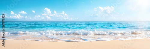panoramic view of beautiful turquoise sea with waves gently lapping sandy beach under clear blue sky