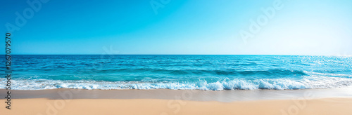 panoramic view of beautiful turquoise sea with gentle waves lapping against sandy beach under clear blue sky, creating serene and tranquil atmosphere