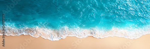 Aerial view of beautiful turquoise sea meeting sandy beach with gentle waves