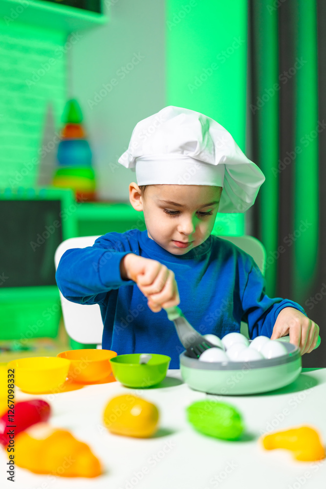 Young chef plays with toy food. A child in a chef's hat plays with toy eggs and colorful bowls, engaged in a creative cooking activity indoors. Young chef plays with toy food. A child in a chef's hat plays with toy eggs and colorful bowls, engaged in a creative cooking activity indoors.