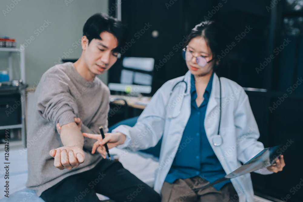 Fototapeta premium Female physician reads medical history while visiting her patient