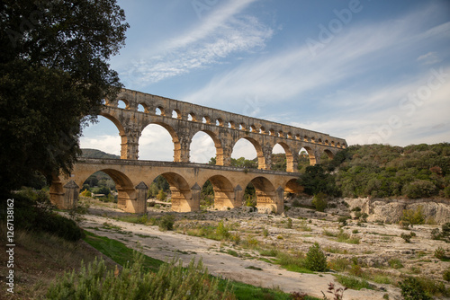 Pont du gard roman aqueduct in occitanie, france with river and trees