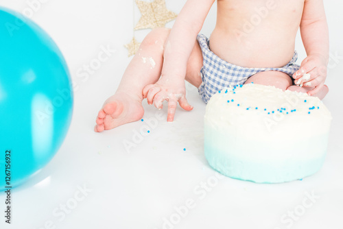 Baby playing with cake sprinkles