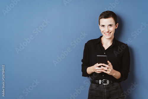 Stylish Woman in Black Shirt Holding Smartphone photo