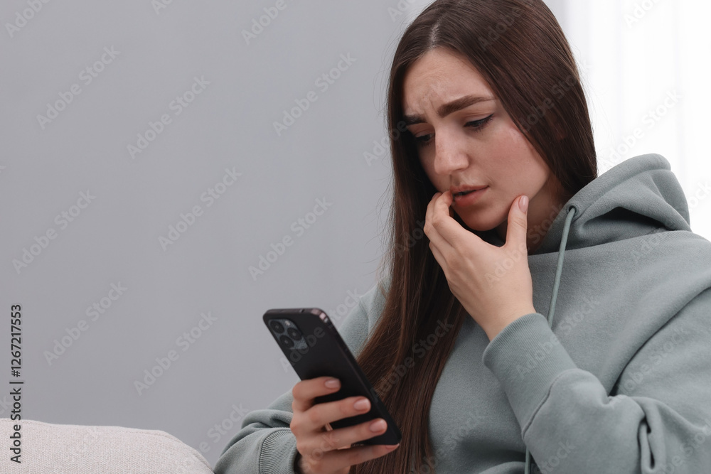 Stressed woman calling hotline for mental health help at home. Space for text Stressed woman calling hotline for mental health help at home. Space for text