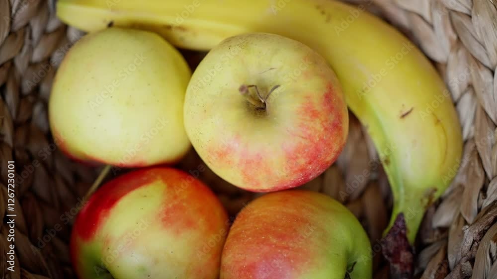 A Beautiful Basket Filled with Fresh and Colorful Fruits Including Juicy Apples and Ripe Bananas A Beautiful Basket Filled with Fresh and Colorful Fruits Including Juicy Apples and Ripe Bananas
