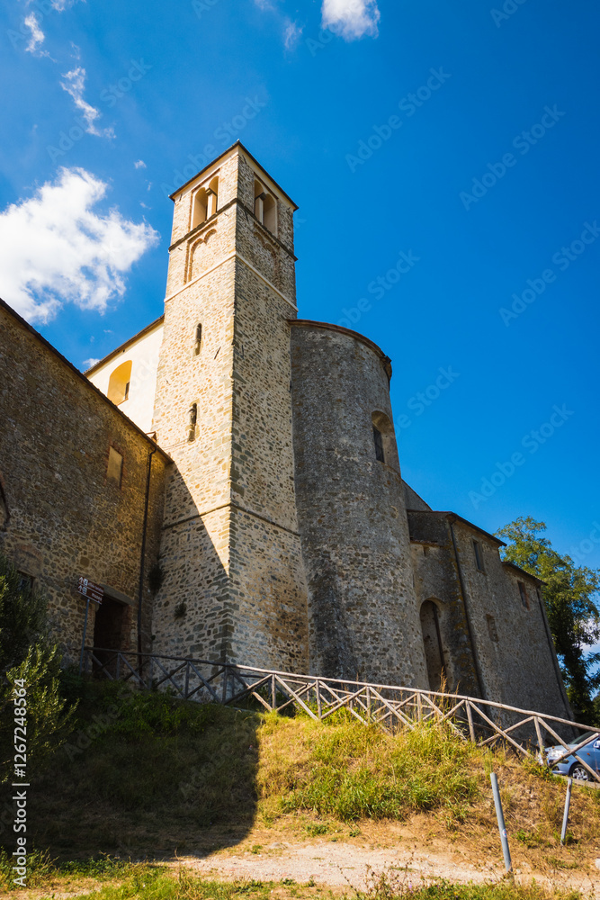 Typical fortified church in tuscany old medieval town of Scansano represents typical view when travelling across the italian countryside between the small towns, vineyards and fields during summer. Typical fortified church in tuscany old medieval town of Scansano represents typical view when travelling across the italian countryside between the small towns, vineyards and fields during summer.