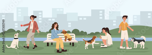 People walk and play with dogs in the city park. Playing with friends and puppy. Playing with animal. People in eco city park. Happy people with dog.