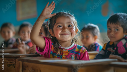 A group of happy children sitting at their desks in a bright classroom, a girl eagerly raising her hand to answer a question. photo
