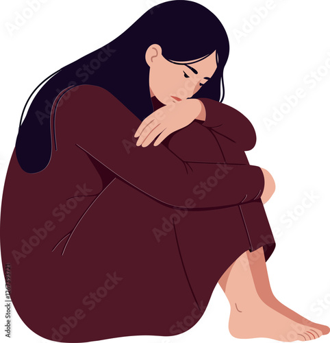 Woman sitting alone with her arms wrapped around her knees in thought