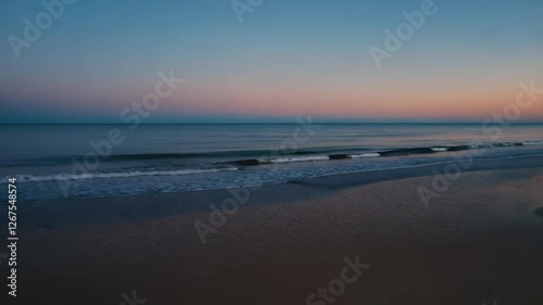 Wallpaper Mural Calm ocean waves gently lapping on a tranquil beach at sunset, beauty of a secluded beach where gentle waves kiss the sandy shore under a vibrant sunset. The sky transforms with stunning hues  Torontodigital.ca