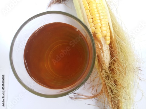 Corn hair boiled water on a glass. One of herbal traditional drink photo