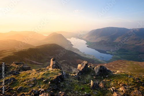 Canvas Print Golden evening light over Lake District mountains on a summer evening seen from Red Pike, UK