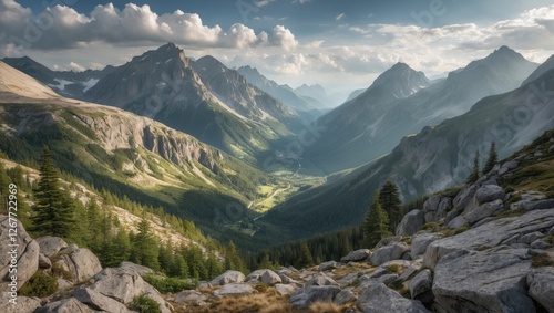Mountain landscape with valleys and rocky terrain under a cloudy sky showcasing natural beauty and depth Copy Space