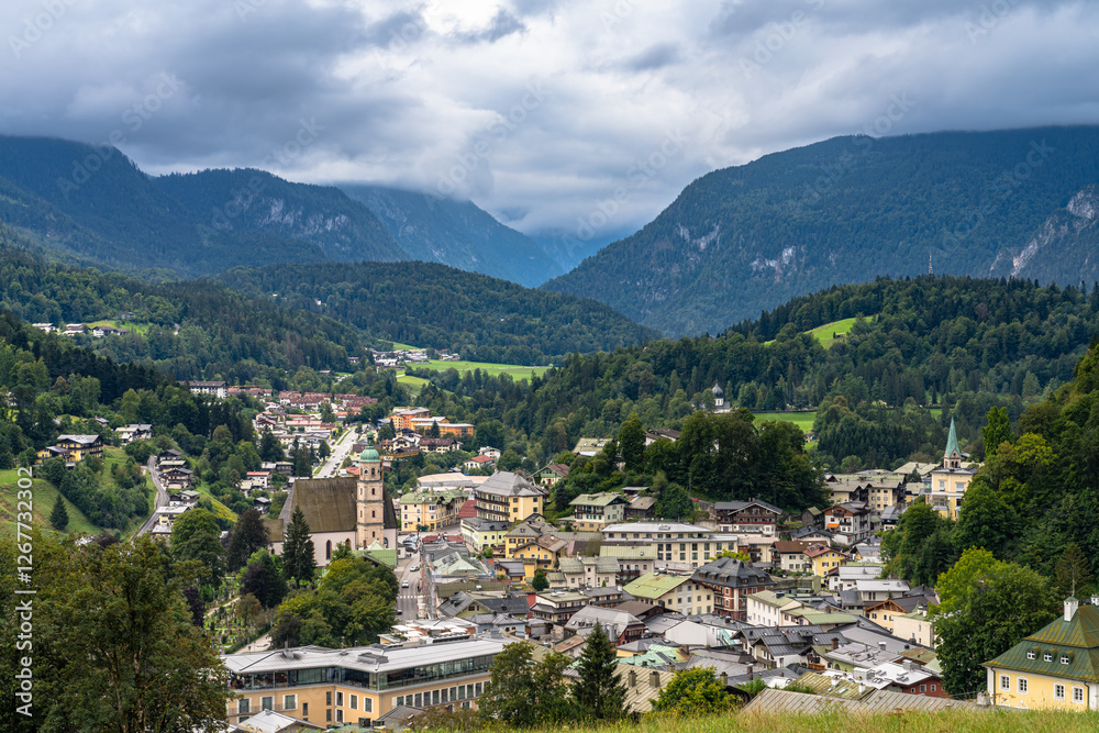 Obraz premium Aerial panorama view of the old town of Berchtesgaden with the Bavarian alps in background, on a cloudy day in summer, Bavaria, Germany
