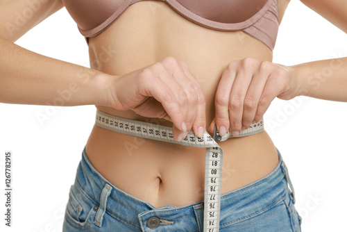 Εκτύπωση καμβά Woman measuring waist circumference on white background, closeup