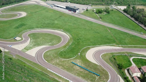 Zig zag racetrack of large autodrome from aerial view shot in sunny day, road markings for sport cars racing and competition