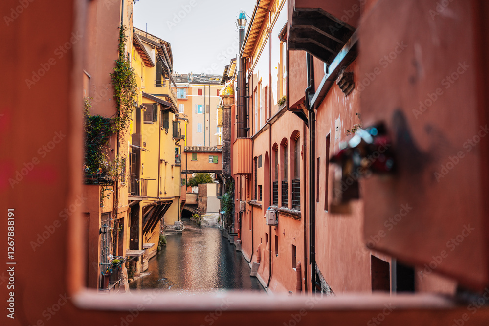 Bologna's canal, colorful buildings, and charming alleyways.