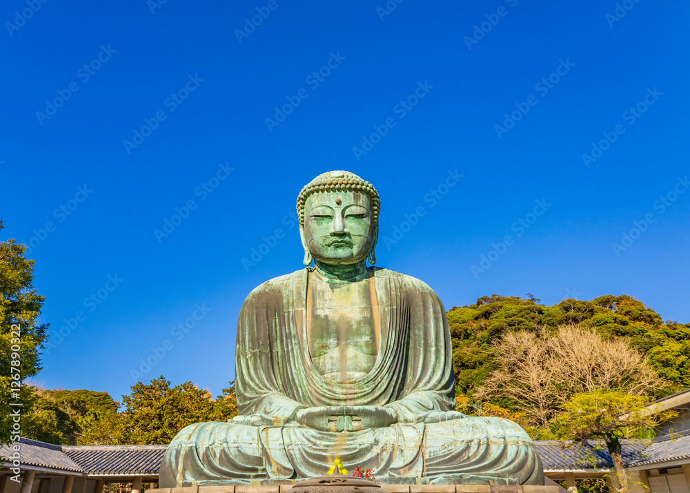 Ancient bronze statue of the Great Buddha Daibutsu at Kotoku-in temple in Kamakura, Japan. It is an important landmark and a popular destination for tourists. Ancient bronze statue of the Great Buddha Daibutsu at Kotoku-in temple in Kamakura, Japan. It is an important landmark and a popular destination for tourists.