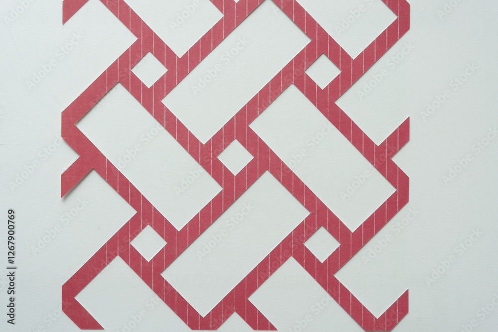 abstract, machine-cut basketweave or interweave pattern on blank paper abstract, machine-cut basketweave or interweave pattern on blank paper