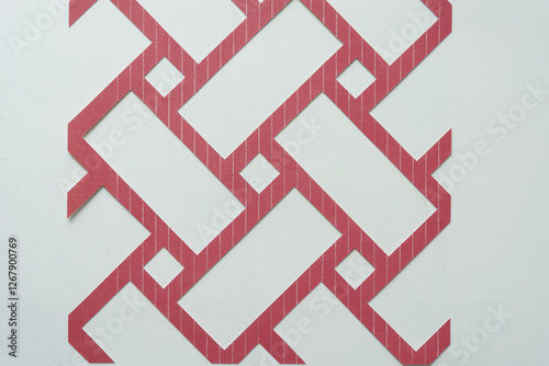 abstract, machine-cut basketweave or interweave pattern on blank paper photo