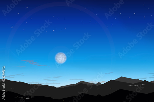 mountains with a night sky lit by the moon and stars