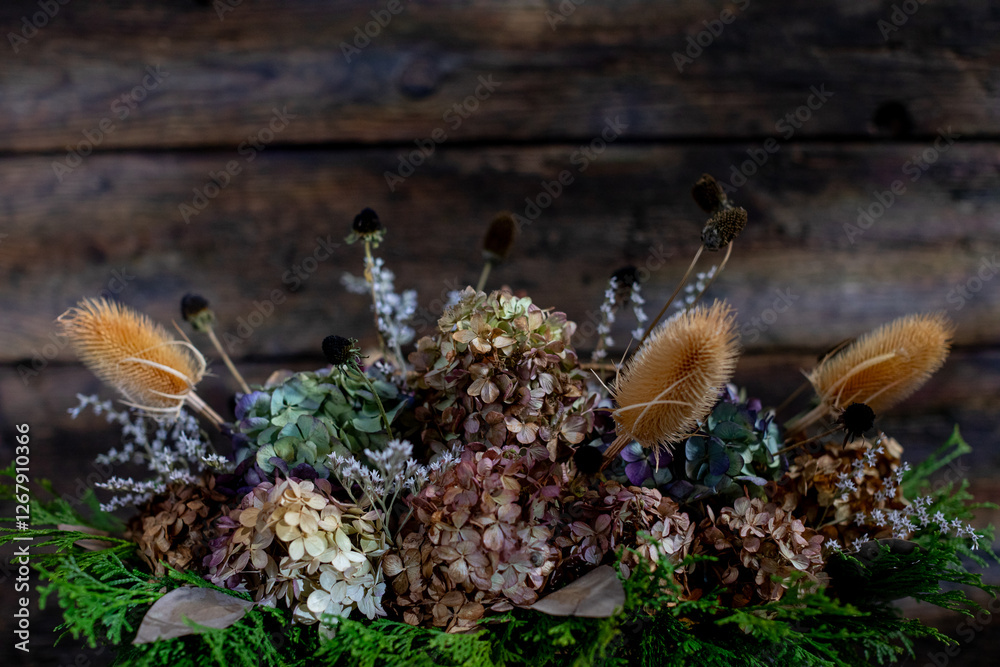 A Charming and Beautiful Dried Floral Arrangement Set Against a Rustic Background Setting