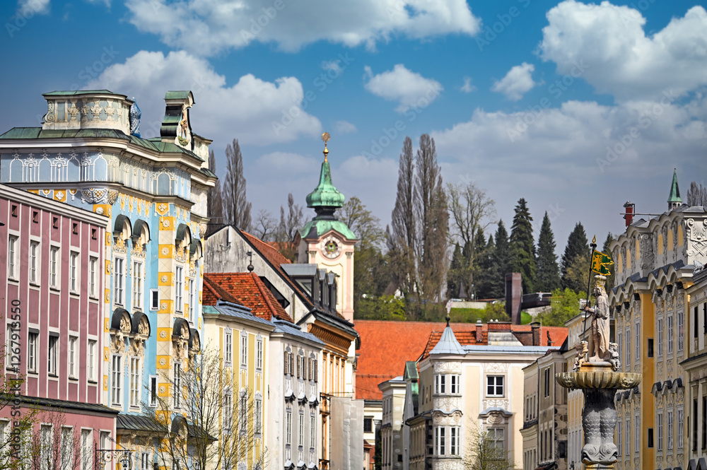 Fototapeta premium Colorful old buildings and church in Steyr, Upper Austria, Austria