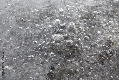 Bubbles of air frozen in river water flat lay