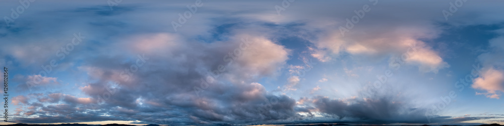 Fototapeta premium Stunning Panorama of Clouds Over a Vast Landscape at Dawn With Soft Colors