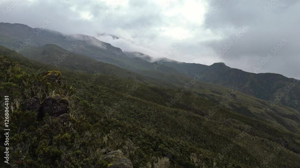 Aerial view of lush mountain slopes and misty peaks in Tanzania Aerial view of lush mountain slopes and misty peaks in Tanzania