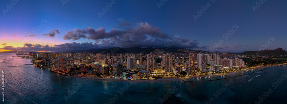 Naklejka premium Aerial View Of Waikiki Beach Towards Honolulu At Sunset