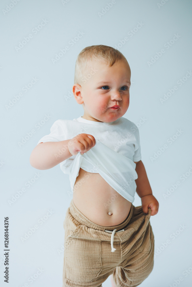 A playful toddler in a casual outfit, exuding joy, fun, and a spirit of discovery