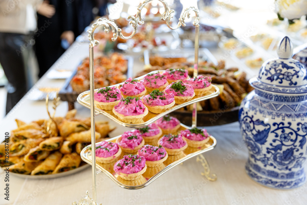 Naklejka premium catering buffet with different food snacks and appetizers on table