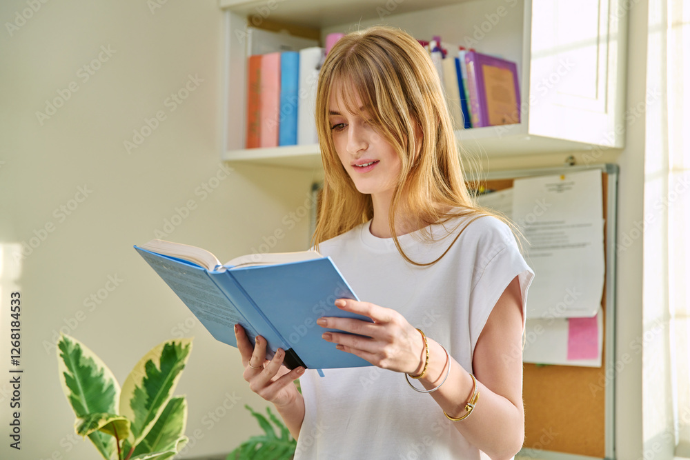Young teenage female reading book, novel, fiction educational literature at home Young teenage female reading book, novel, fiction educational literature at home