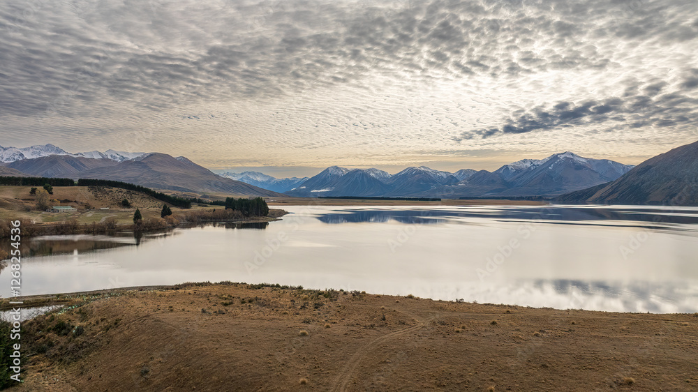Drone view of the Ashburton highlands with a river an lake in the dry arid terrain on the way to Lake Heron Drone view of the Ashburton highlands with a river an lake in the dry arid terrain on the way to Lake Heron