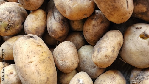 Fresh organic potatoes in the market. Close-up. Selective focus.